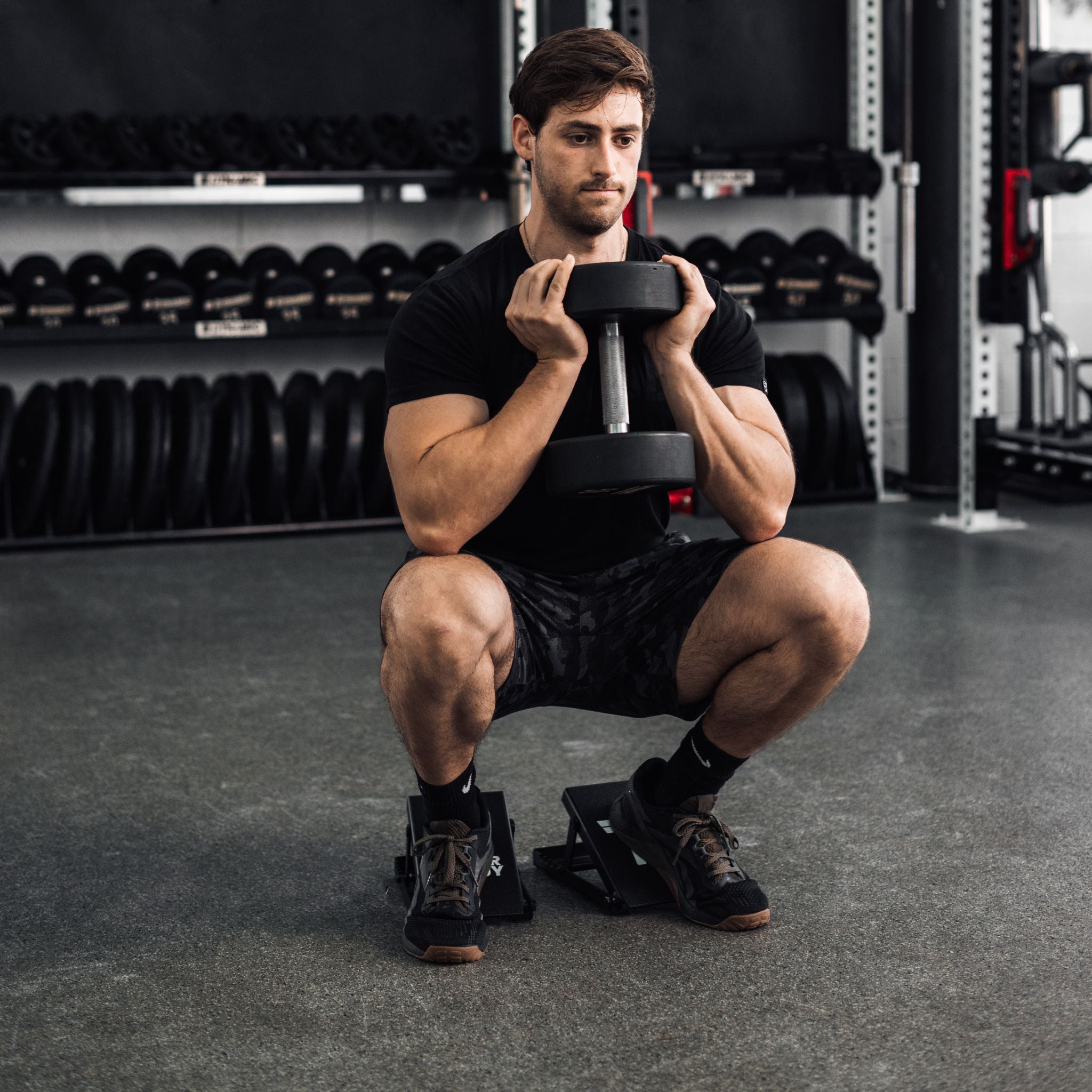 A Man Using The Slant Ramps | Top Adjustable Squat Wedges | The Tib Bar Guy